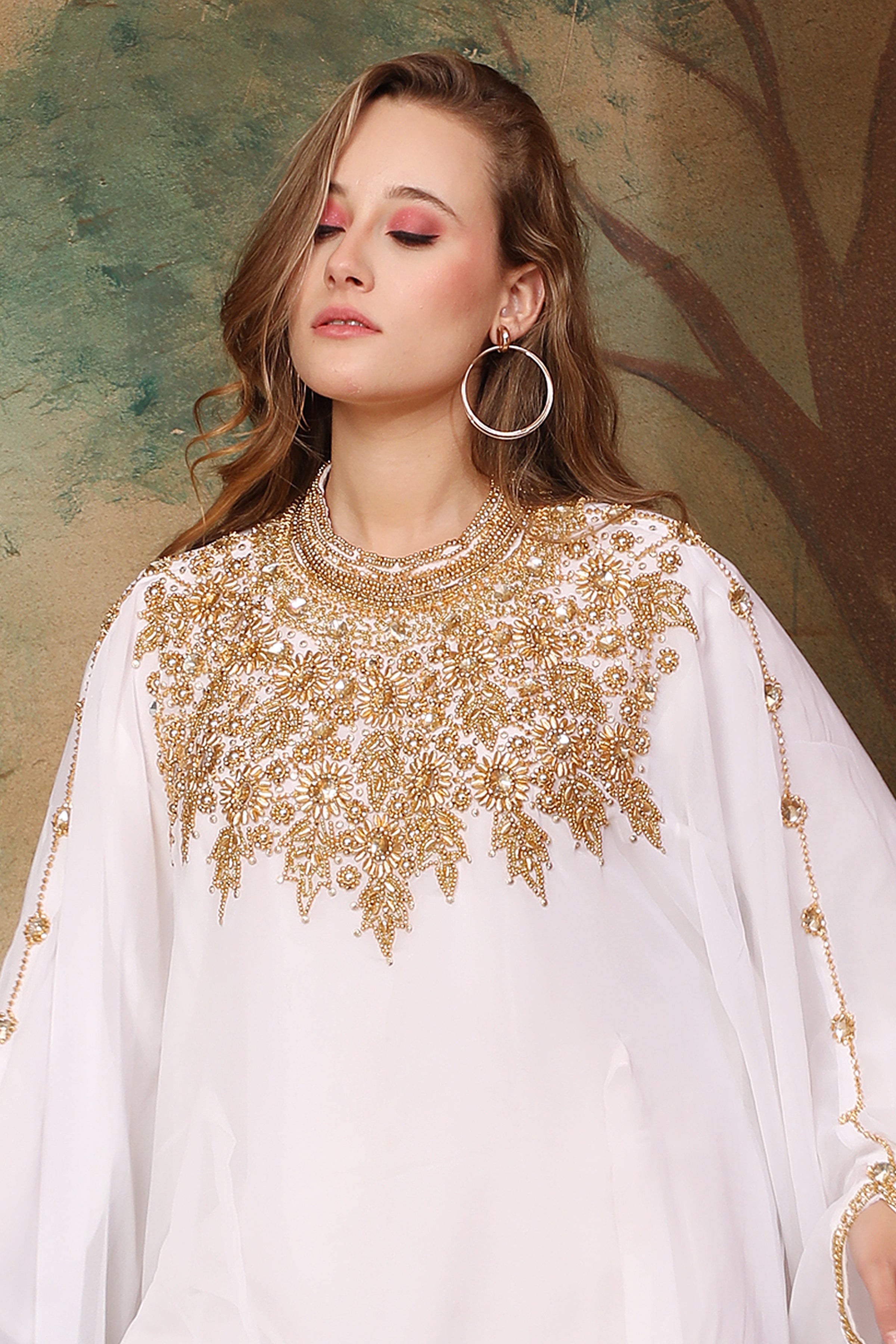 Closeup of Amina White Farasha Kaftan With Hand Embroidery