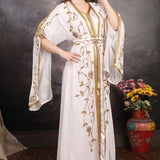 Model wearing Dahab Gold Hand-Embellished Moroccan Caftan, full-length modest luxury outfit.